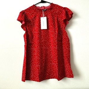 Red with white polka dot blouse